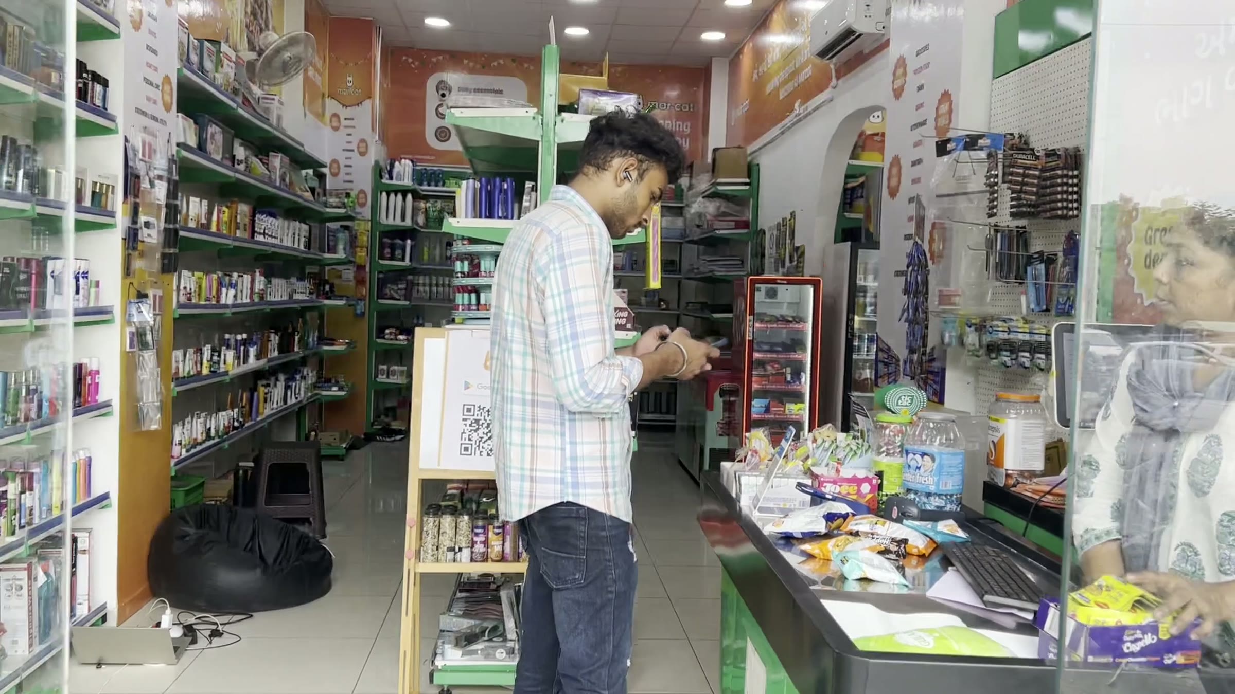 Inside Banjara: stocked aisles and a customer at the shelf